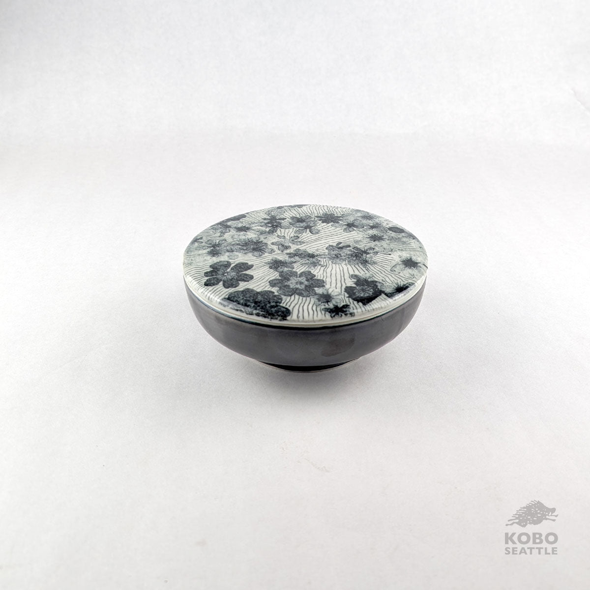 Lidded Container with Strewn Flowers by Laura Brodax