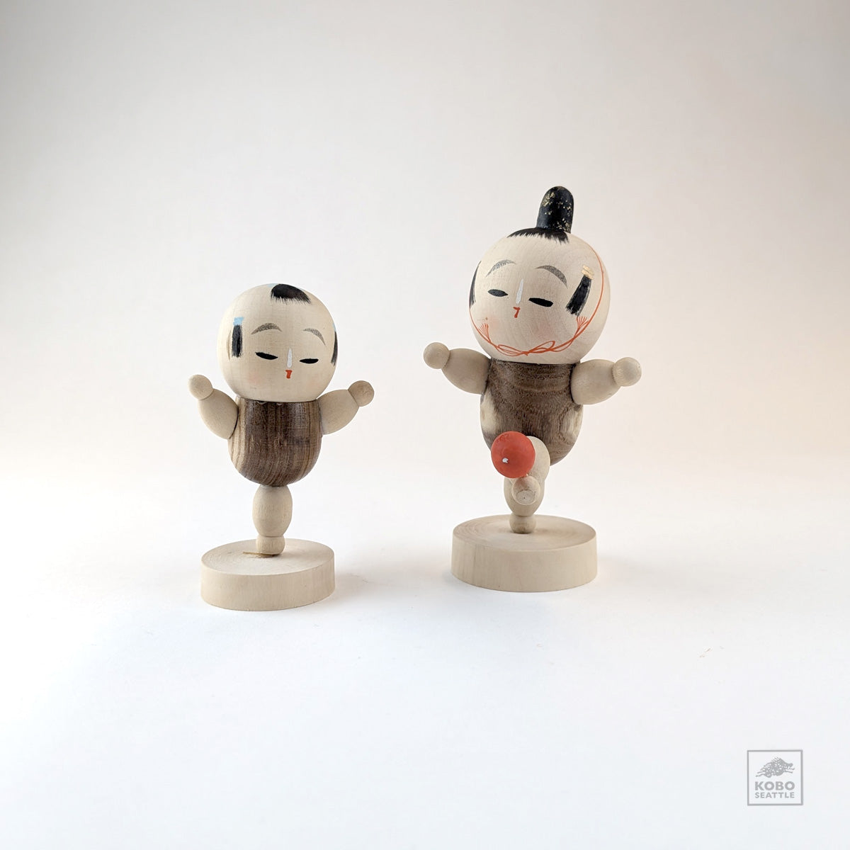 Vintage Kokeshi Pair Kicking a Red Ball