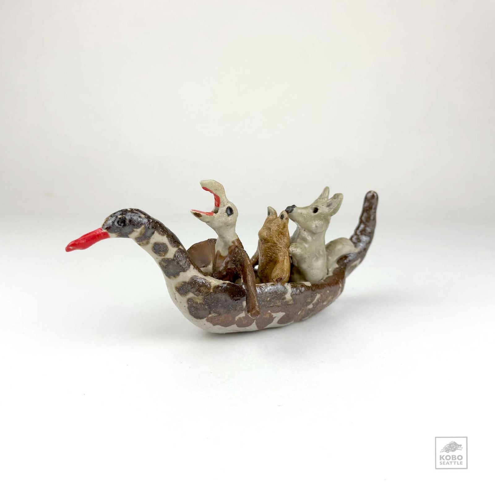 Eagle, Frog, and Wolf in a Duck Canoe by Aaron Murray
