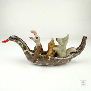 Eagle, Frog, and Wolf in a Duck Canoe by Aaron Murray