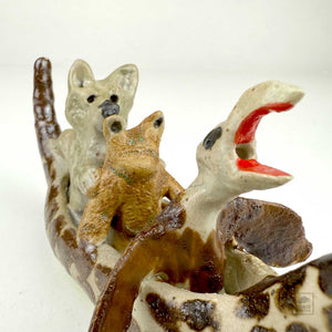 Eagle, Frog, and Wolf in a Duck Canoe by Aaron Murray