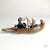 Cat, Rabbit, and Dog in Otter Canoe by Aaron Murray