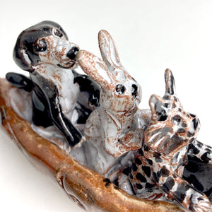 Cat, Rabbit, and Dog in Otter Canoe by Aaron Murray