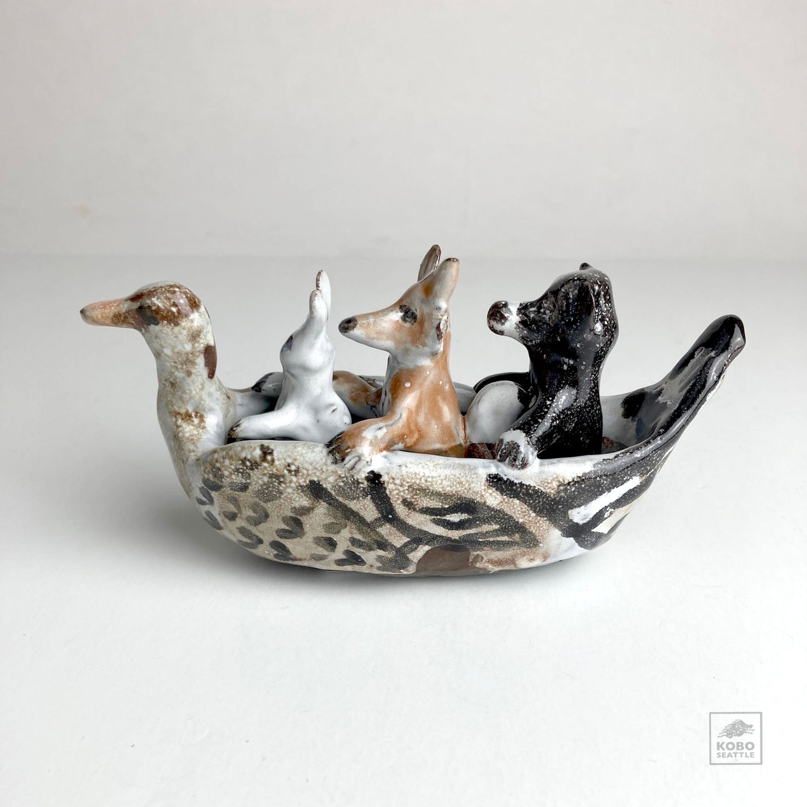 Rabbit, Wolf, and Bear in Duck Canoe by Aaron Murray