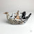 Rabbit, Wolf, and Bear in Duck Canoe by Aaron Murray