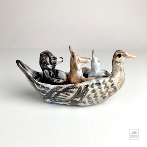 Rabbit, Wolf, and Bear in Duck Canoe by Aaron Murray