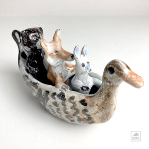 Rabbit, Wolf, and Bear in Duck Canoe by Aaron Murray
