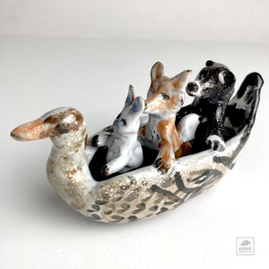 Rabbit, Wolf, and Bear in Duck Canoe by Aaron Murray