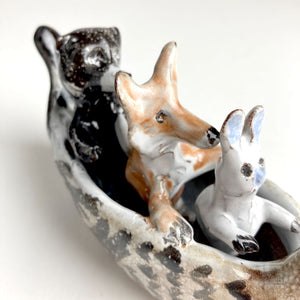Rabbit, Wolf, and Bear in Duck Canoe by Aaron Murray