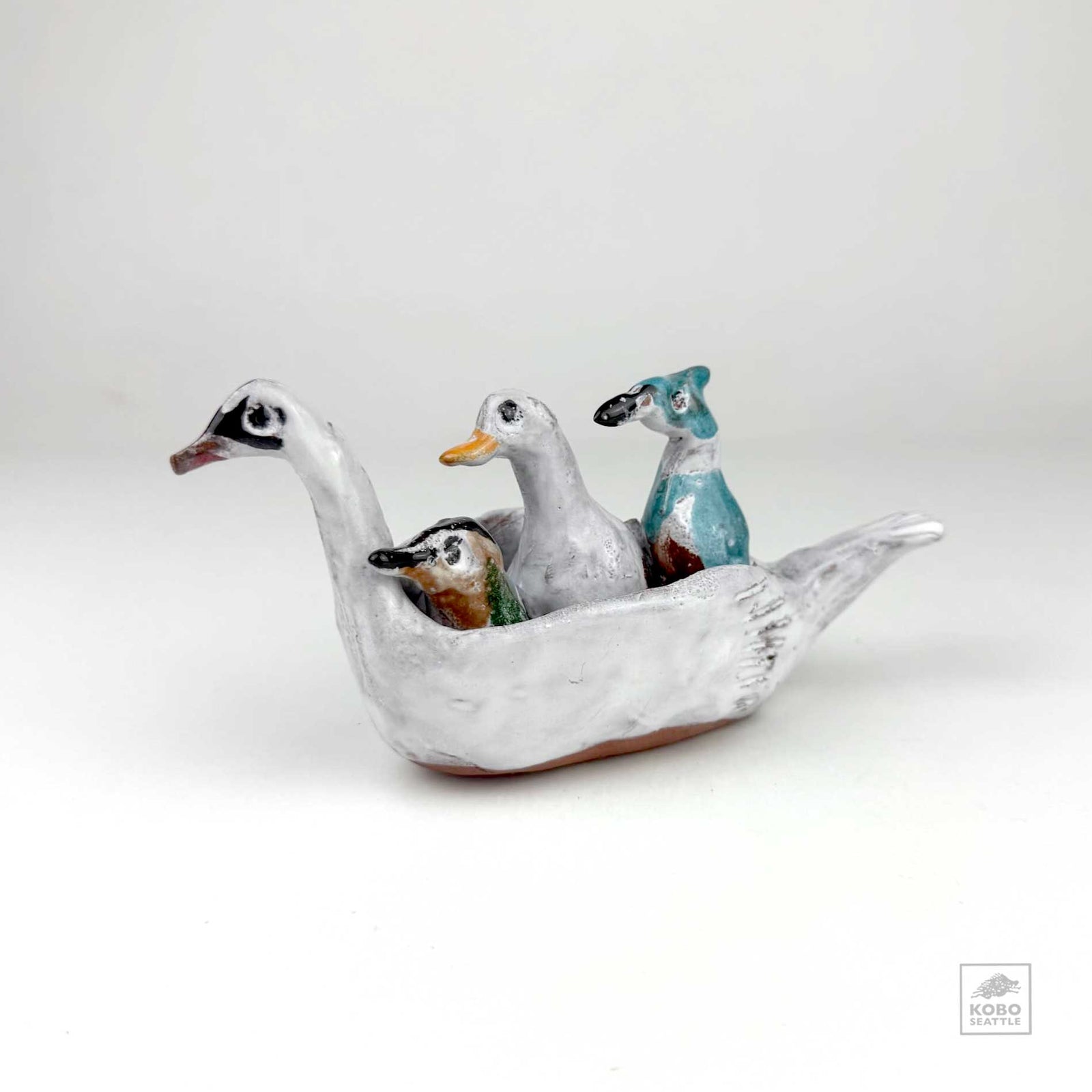 Hummingbird, Duck, and Jay in a Swan Canoe by Aaron Murray