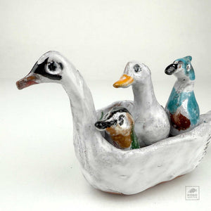 Hummingbird, Duck, and Jay in a Swan Canoe by Aaron Murray