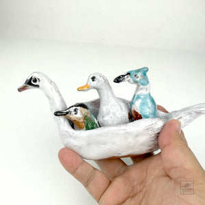 Hummingbird, Duck, and Jay in a Swan Canoe by Aaron Murray