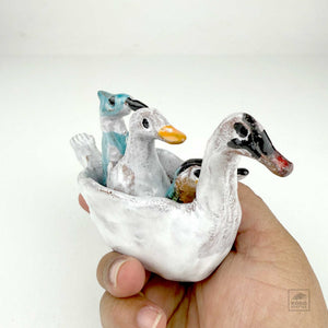 Hummingbird, Duck, and Jay in a Swan Canoe by Aaron Murray