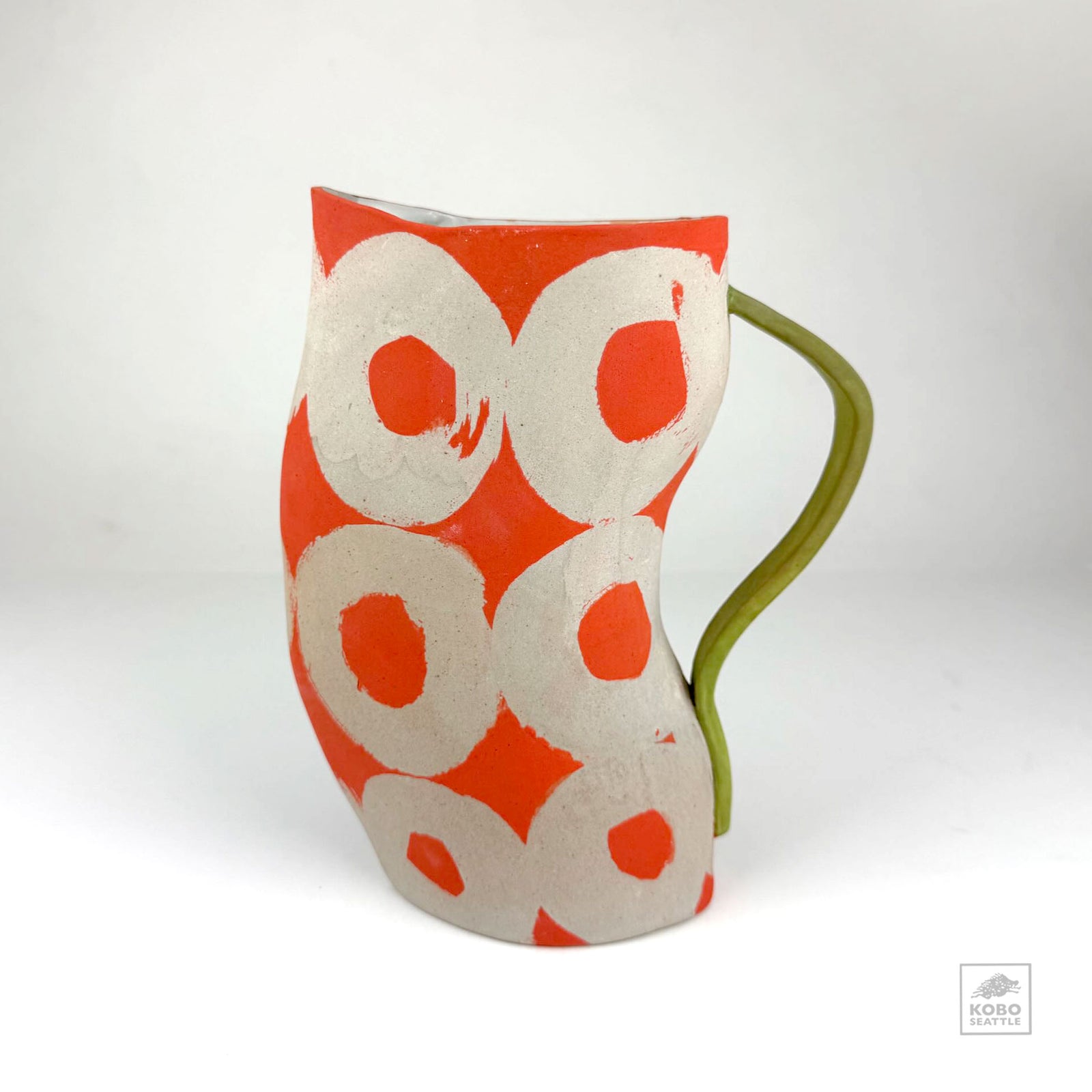 Orange Pitcher with Green Handle by Christine Westergaard