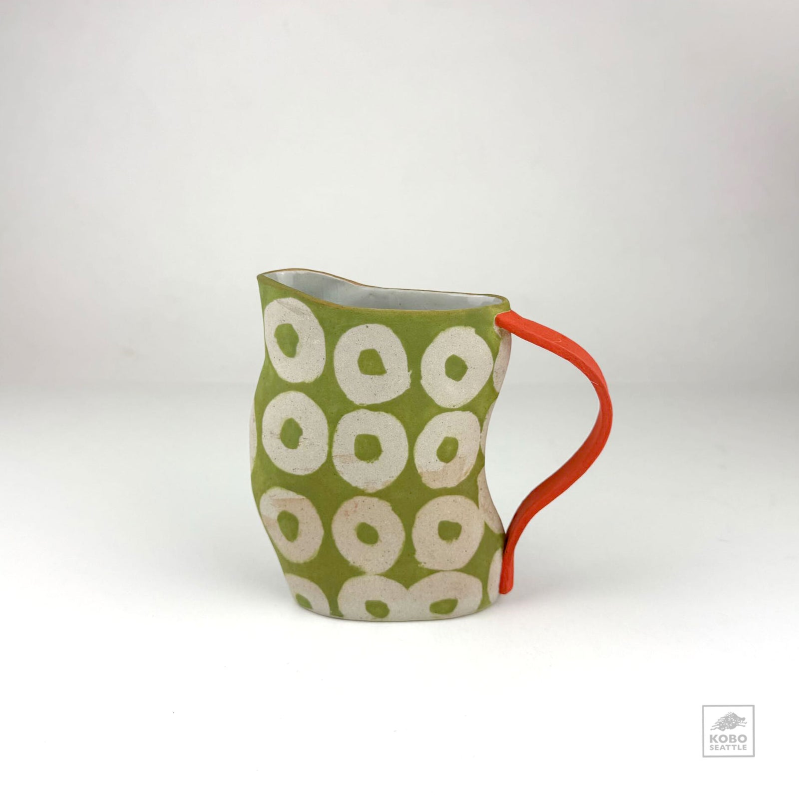 Green Pitcher with Orange Handle by Christine Westergaard