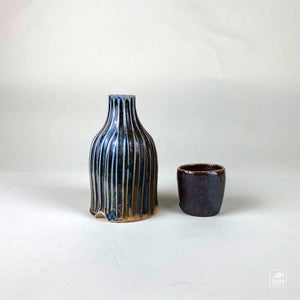 Bottle & Cup by Robin Hominiuk