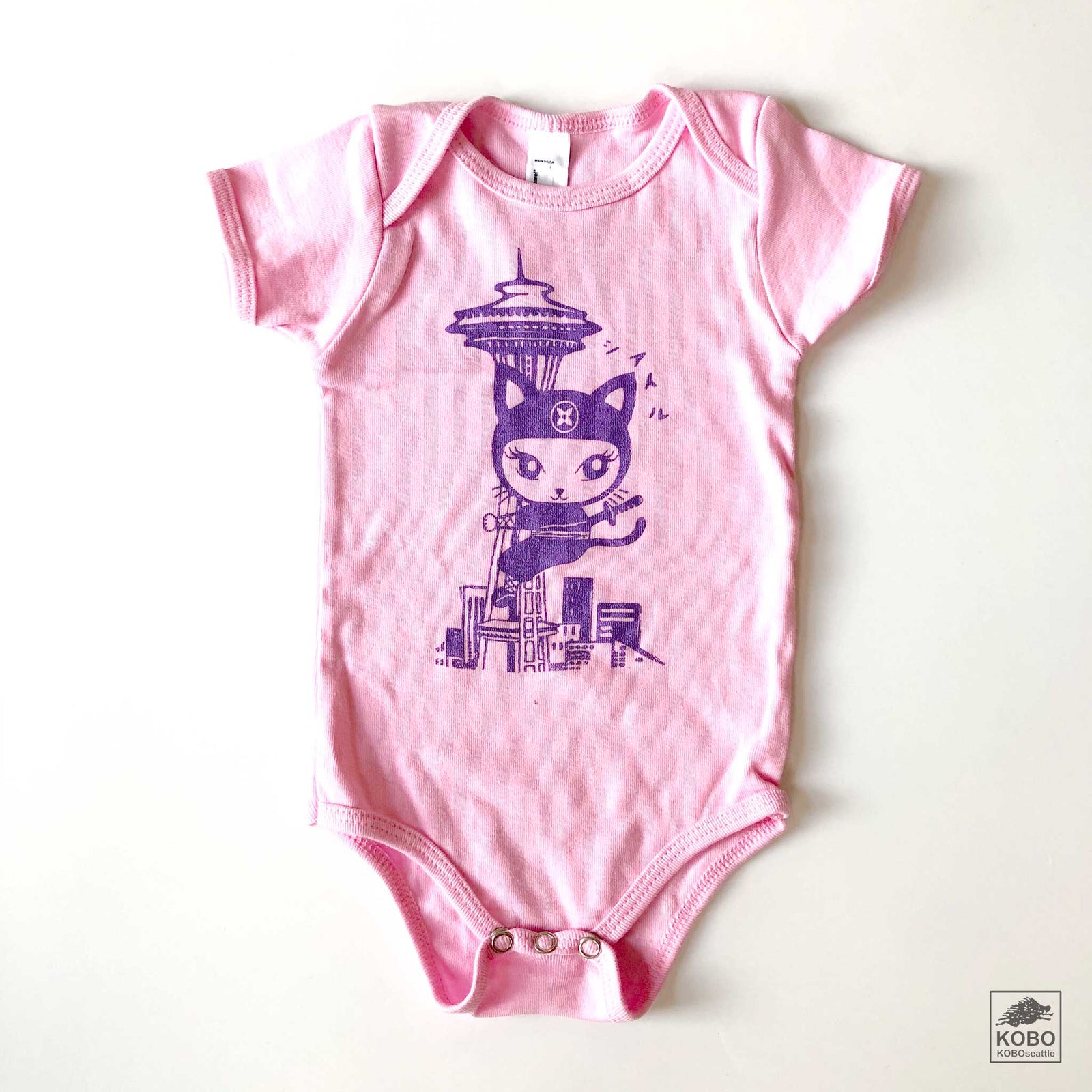 Pink Onesie - Ninja Cat and Space Needle by Namu